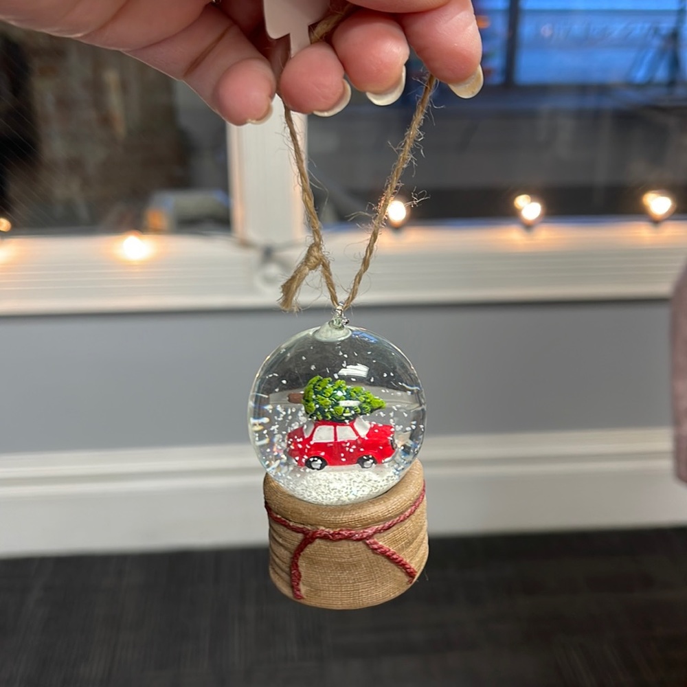 Snow globe Christmas ornament red car bring home Christmas tree.